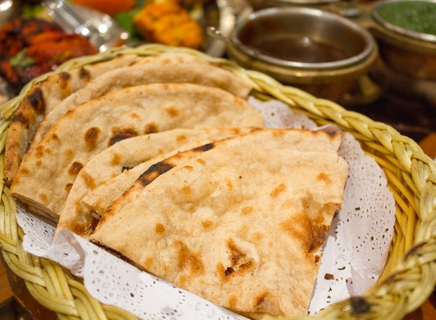 Indian breads, curry, rice and fresh accompaniments