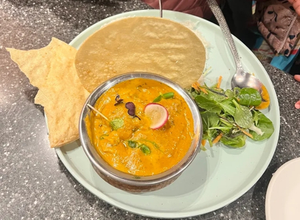 Rich butter chicken curry with garlic naan